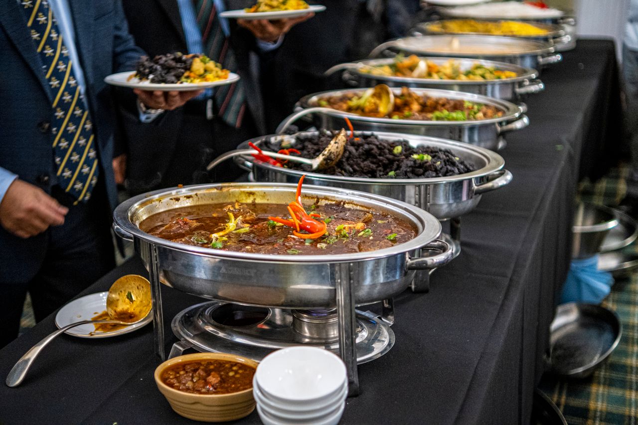 Crafting Captivating Headlines: Your awesome post title goes here Elegant buffet display with various dishes served in warmers at a catered event.