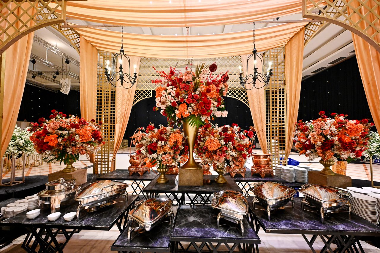 The Art of Drawing Readers In: Your attractive post title goes here Elegant wedding venue with lavish floral decor and buffet setup in Bandung, Indonesia.
